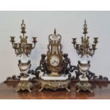 A Paris Regnant Empire style clock with white marble and brass cherub fauns holding floral swag