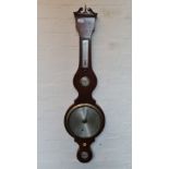 A mahogany silver face wall barometer.