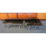 Two chrome framed designer coffee tables with glass top.