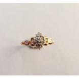 A 9ct gold small cluster ring.