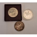 A 1977 Queen Elizabeth Commemorative coin with a 1951 George VI five shilling coin and a 1900