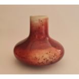 A Ruskin high fired red to cream bulbous vase. 1922 approx height 20cm