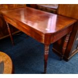 A 19th century mahogany D end side table with turned legs.
