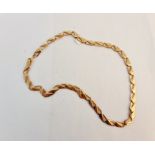 A yellow metal link chain, approx. length 40cms