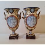A pair of large French style yellow and blue lion head gilded handles vases with cameo style