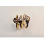 A stamped 18ct cluster ring (stones missing), ring size P1/2, a rubbed marked 18ct cluster ring (