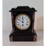 A black slate mantle clock with marble sides. 26 cm.