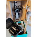 A OMO microscope in travel box and lenses.