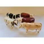 Five Beswick bulls and cows.