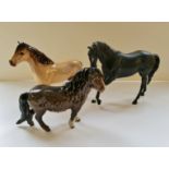Three Beswick horses black beauty, highland, and pony.