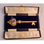 A silver gilded presentation key in a Fattorini and Sons Goldsmiths Bradford box.
