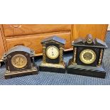 A black slate and marble mantle clock together with a metal mantle clock with French movement.