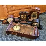 Four wood cased mantle clocks together with a oak wall clock.