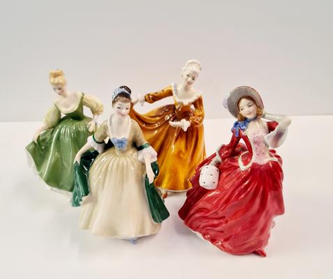 Four Royal Doulton figures Kirsty, Autumn Breezes, Elegance, and Fair Lady.