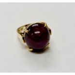 A stamped 14k purple stone ring, ring size K