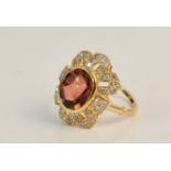 A yellow metal pink gem stone and diamond accents cluster ring, ring size L 1/2,