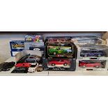 A collection of boxed and lose diecast cars Burago,Maisto etc.