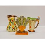 Two hand painted Myott pottery water jugs and one fan vase.