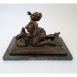 An erotic bronze figure of lady on rug with marble base length 33 1/2.