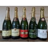 Five bottles of various champagne