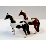 Two Beswick Pinto horses.