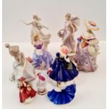 A collection of nine figurines to include Wedgwood, Lladro, Royal Doulton, and Coalport.