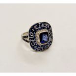 A stamped PLAT. sapphire and diamond cluster ring, ring size M