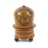 An early print and paint decorated Tunbridge ware pin poppet in the form of a bee skep, with a