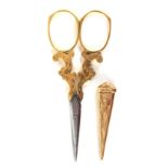A fine pair of late 19th Century gold mounted scissors with sheath, the diamond section tapering