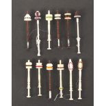 Twenty six Tonder lace bobbins, eighteen in wood, four with simulated ivory tops, and eight in