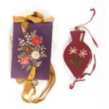 Two material needle books, comprising a purple silk example of rectangular form the covers with