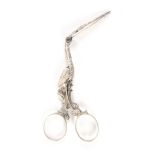 A pair of Dutch silver stork form ribbon scissors, the bird with jewelled eyes, opening to reveal