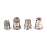 Four silver thimbles, comprising a stone top example with frieze of Irish harp and shamrocks by