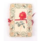 An embroidered card needle book, each cover painted with a botanical water colour within an