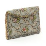 An 18th Century needle book of wallet form, in floral silk (probably Spitafields), with metal thread