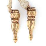 A pair of Dutch gold knitting needle protectors, of octagonal and baluster form with engraved