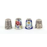 Four silver thimbles by James Swann and Son, comprising a stone top, an enamel EIIR Jubilee, a