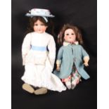 Two porcelain headed dolls, circa 1920, comprising one with head marked 'Armand Marseille,