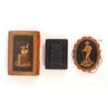 Three needle books, comprising an oval wooden example, inlaid with a male figure and inscribed to