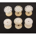 Six mother of pearl top reel holders, comprising a set of three with pierced and engraved tops, 3.