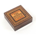 A Tunbridge ware rosewood puzzle box, the lid titled in mosaic 'The Chinese Puzzle' within line
