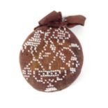 A knitted and beadwork decorated sampler style circular pin cushion dated '1832', the brown ground