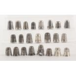 A collection of British silver thimbles comprising twenty three examples, twenty hallmarked