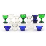 Twelve 19th Century and later eye baths, comprising one ceramic, four clear glass, four blue