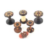 Tunbridge ware - six pieces, comprising a pair of rosewood reels with circular stick ware tops, 3cms