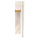 A mother of pearl needle case and a bodkin, the first of rectangular form with gilt band in the