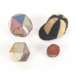 Four pin cushions, comprising a jockey cap in alternate silk segments divided by pins, 5.5cms, two