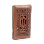 A carved walnut and cloute work needle book, steel bodkin closure, 6.5 x 4cms.