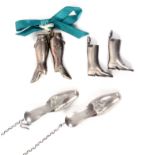Three pairs of silver knitting needle protectors, comprising a Dutch pair in the form of slippers,