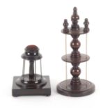 Two wooden reel stands, comprising a mahogany example the turned circular base to a baluster